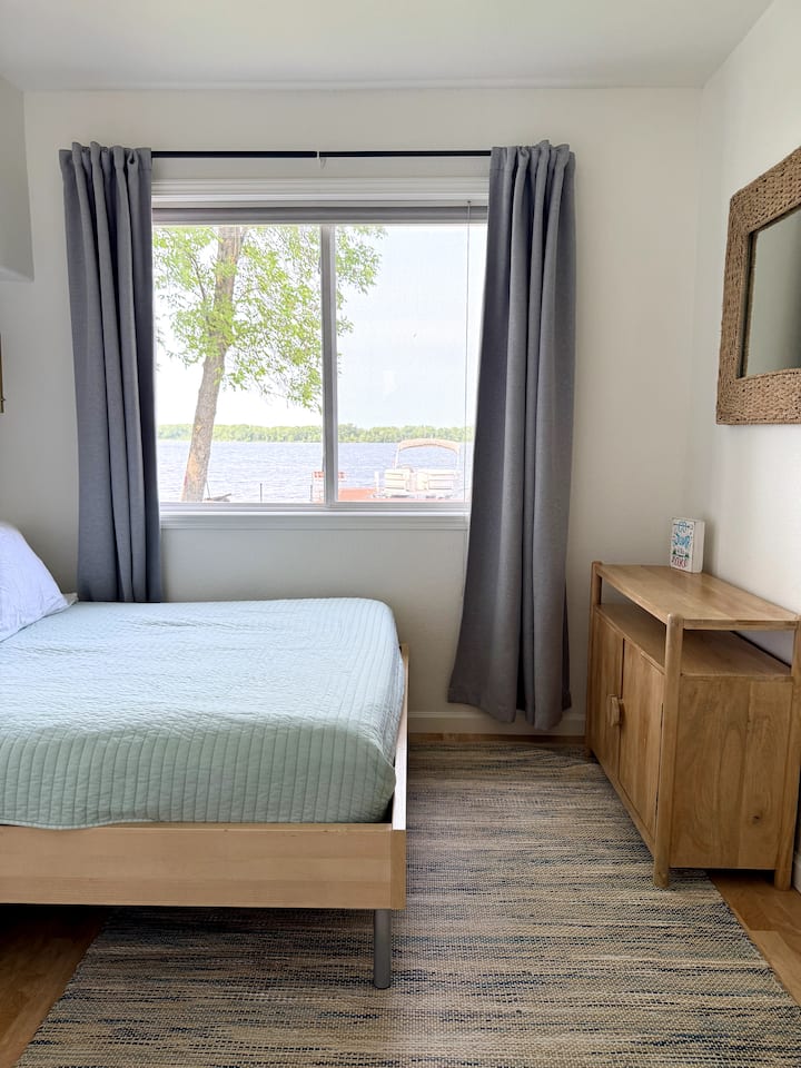 This bedroom has a full size bed, great lake views and a small closet.  All sheets are organic cotton.