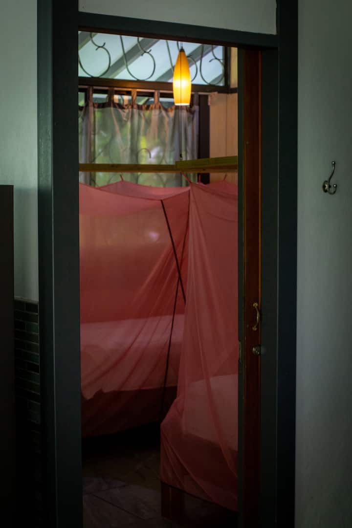 We have two comfortable single beds with mosquito nets and fans in the second bedroom.  We upgrade pillows and sheets on all beds yearly.  There is a standing closet with a safe inside that is used as a secure area for valuables.