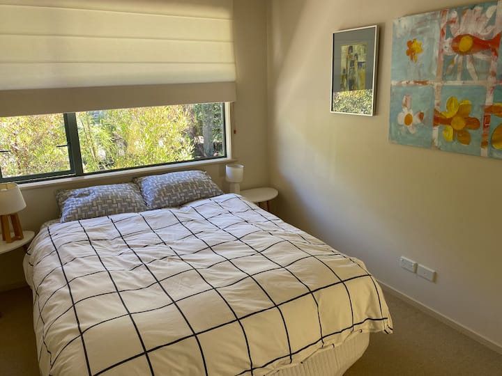 Comfy queen bed with 100% cotton linens and extra pillows for a good night's sleep