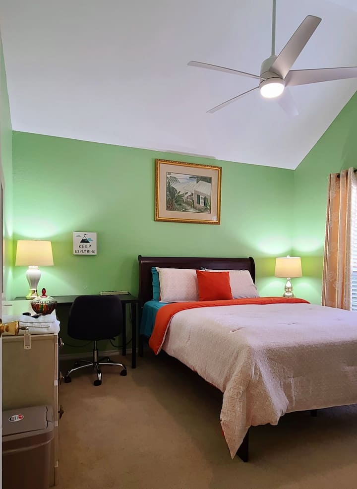 Newly furnished Yellow Flowers room with Top of the line Queen size bed,  lap top friendly executive working table, pleasant lighting, mini fridge, 50" HD LGTV, walkin closet and front yard view.