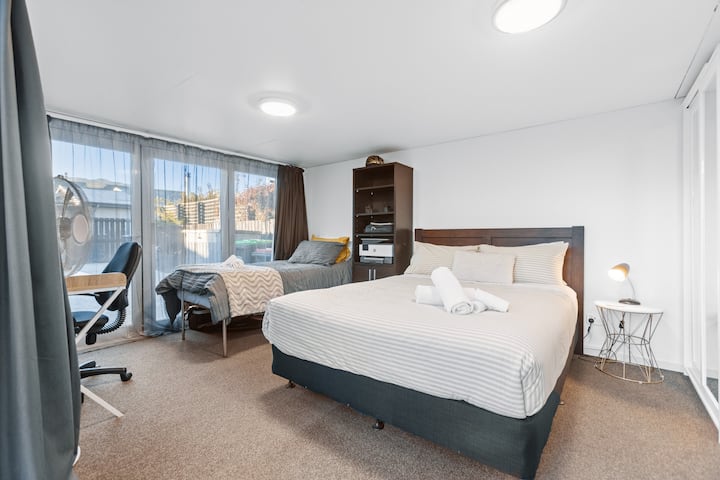 Sleepout, office desk, and single bed