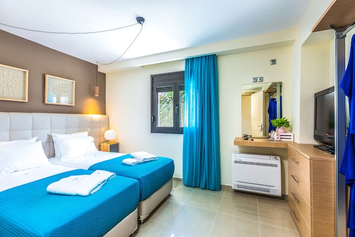 Main Level: Bedroom 5 with two single beds