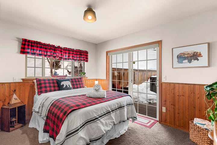 Bear-themed bedroom on the main floor. It has a sliding glass door leading to the hot tub and back deck.