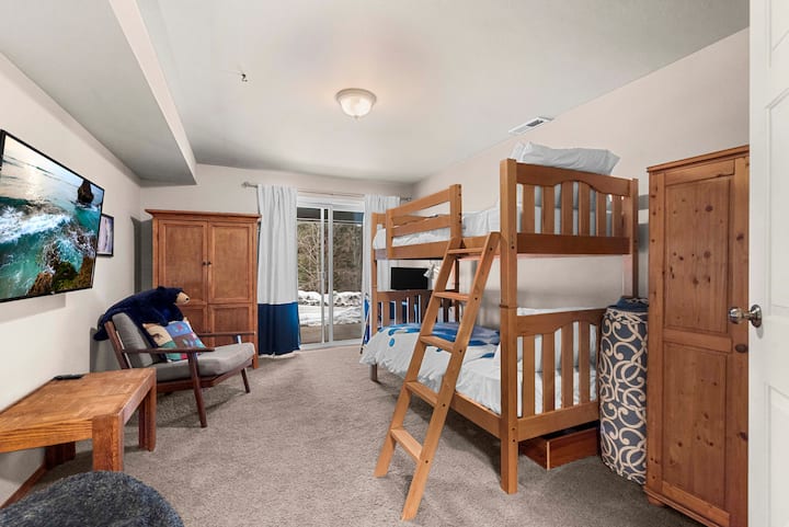 Kids love this space equipped with bunk beds for sleeping. We have two extra floor mats for kids that prefer the floor and there is also an extra TV for video games just within reach to keep them all thoroughly entertained. 