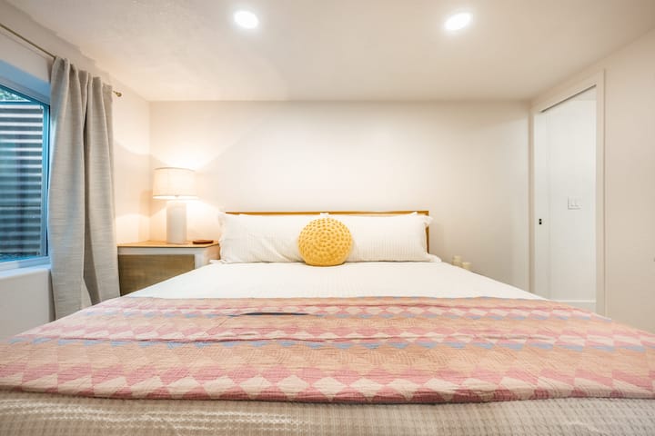 Bedroom on third floor (Two stairs down) with a queen bed- connected to bathroom 3