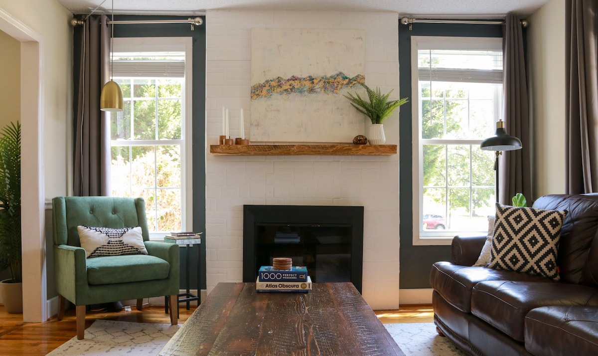 Living room with original art by my mom (M Susan) above the fireplace. 