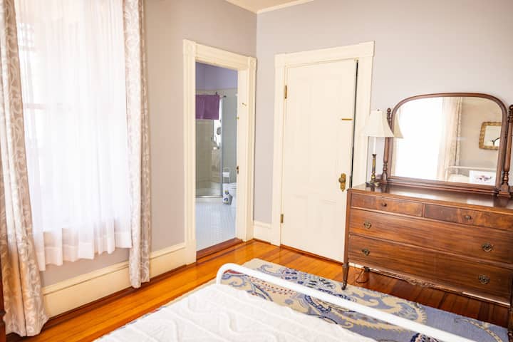 this bedroom has access to the full bath with the walk in shower along with a door to the hall 