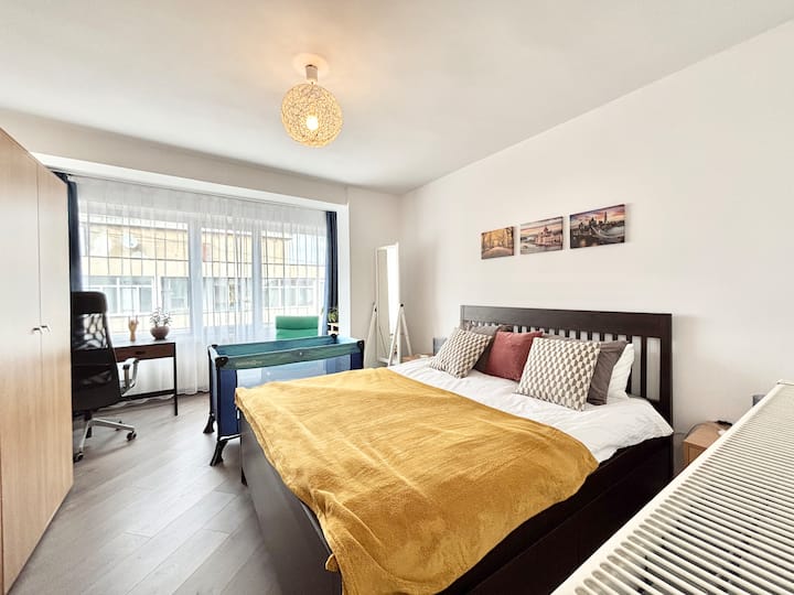 Plenty of space in bedroom even with the added baby crib. The big mirror can be moved around.