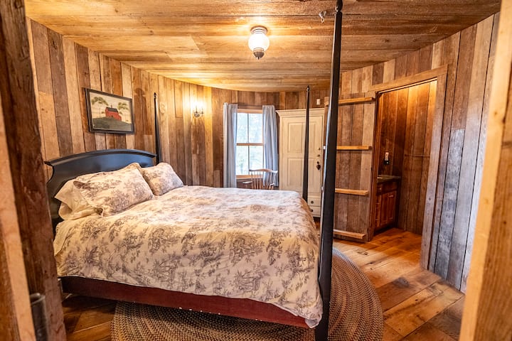 First floor silo bedroom with queen bed and private half bath. 