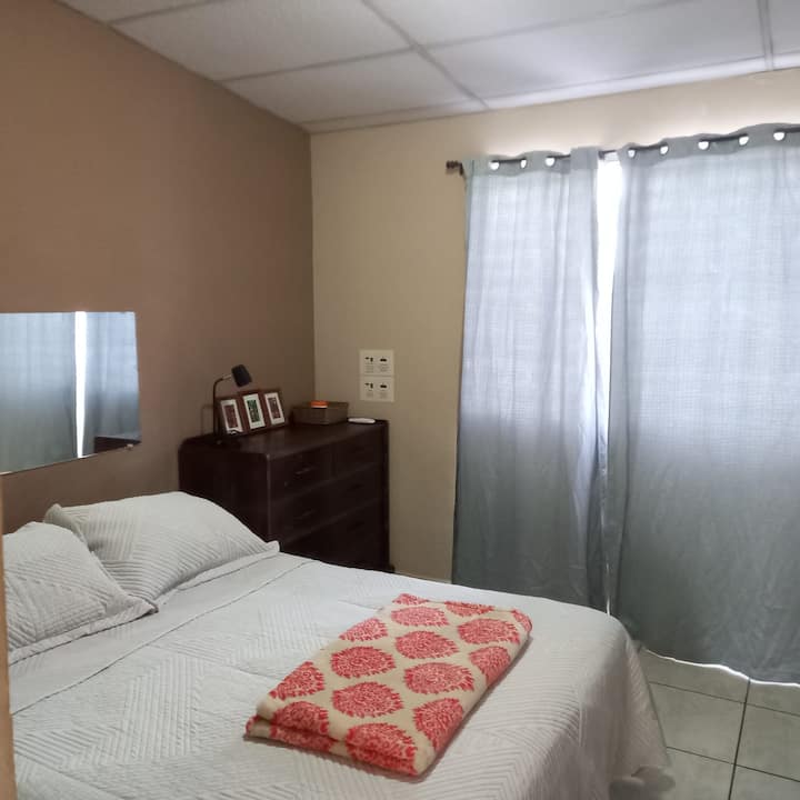 Main bedroom with queen-size bed.