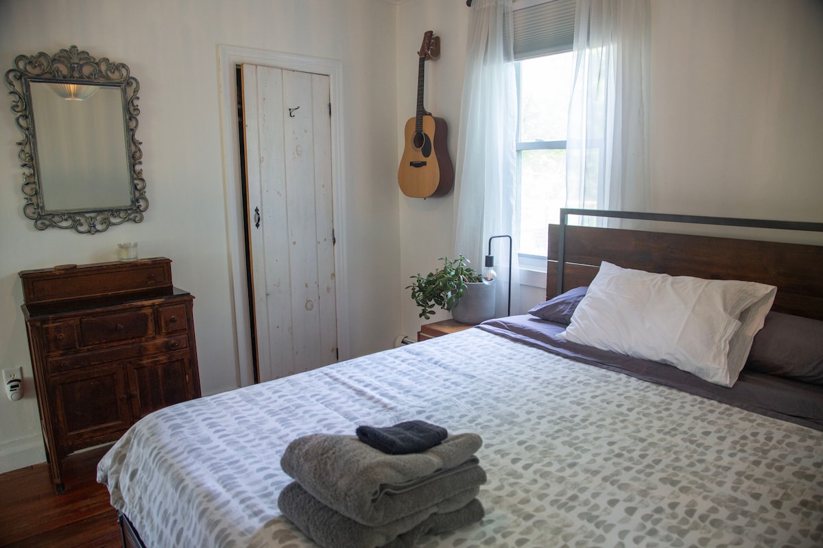Bedroom 2 view 1. Queen-sized bed.