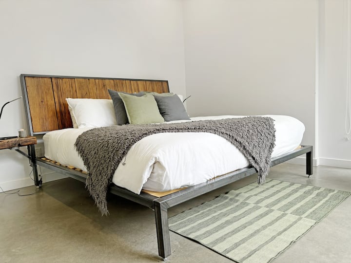 Master Bedroom: King-size retreat adorned with modern decor and plush pillows for ultimate relaxation Ensuite bathroom for total privacy