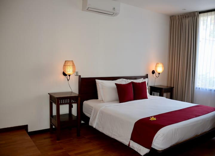 Bedroom 4. Ensuite with a queen bed, spacious wardrobe area and work table.