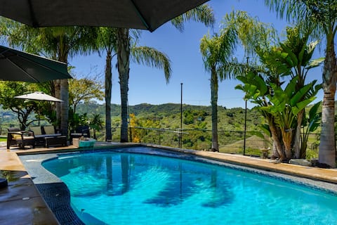 Swim under the palm trees, heated pool with views