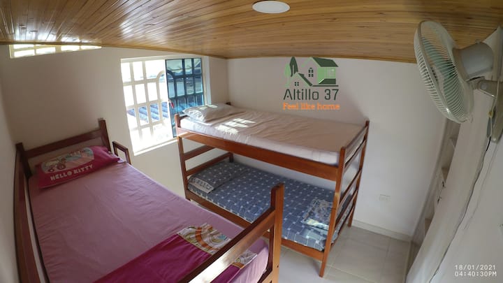 Bedroom 2 has 4 bunk beds with fan, outside window, closep storing clothes and door with lock for your pérsonal privacy.
