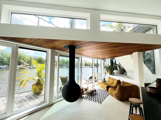 Design sunny houseboat on Amstel river