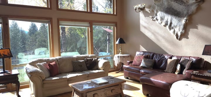 Fireplace Room/Den on main level has queen leather pullout couch - Perfect for those who can't climb stairs. Stairs lead to Eagles Nest Loft. Loft has privacy screen. Can also close door to Den for addl privacy in loft bedroom area.