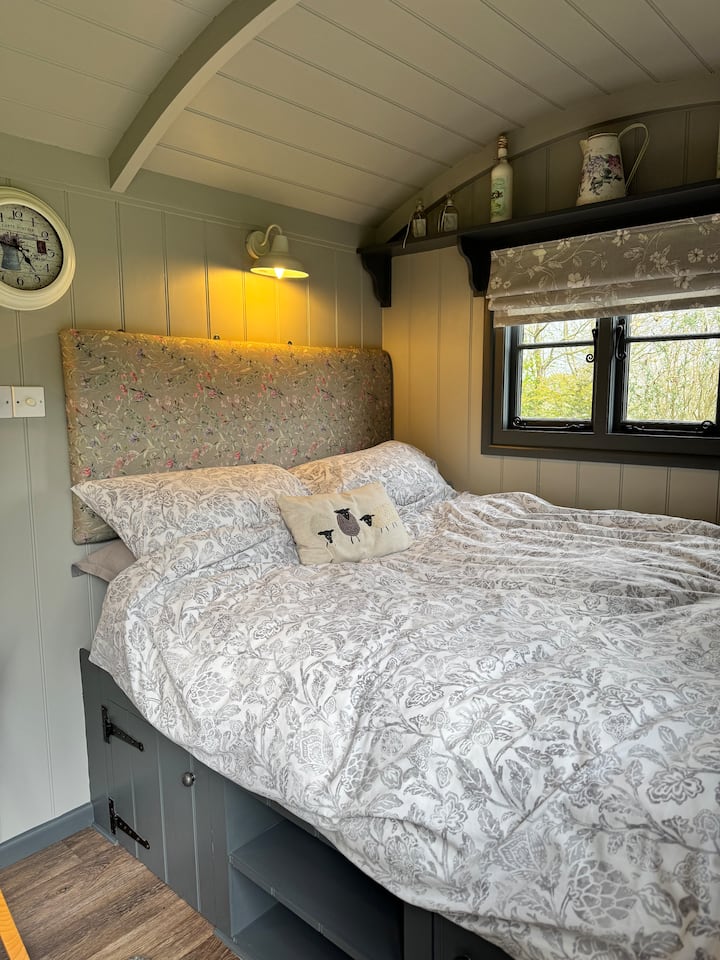 Double bed with upholstered headboard