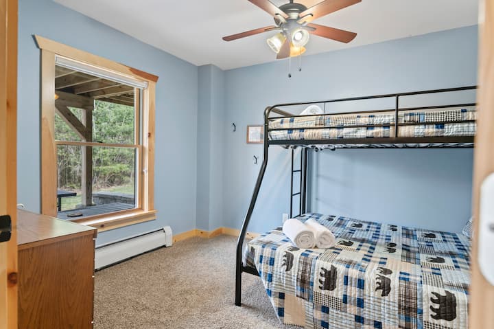 Every room with its own character, this bunk room brings playful cabin vibes and a comfy night’s sleep.
