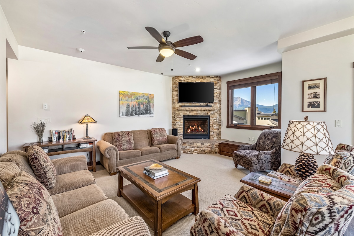 This inviting living room features cozy furniture and a gas fireplace
