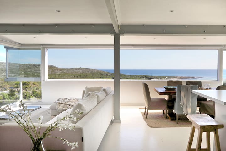 Walk to the Beach from a Stylish Home with Marvelous Views