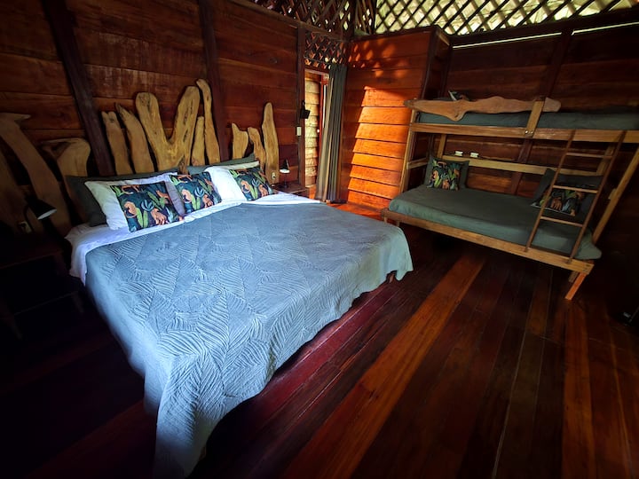 The family bedroom upstairs is amply furnished with a generous king sized bed, along with a bunk bed of double bed below and individual above.  Also available on request crib/play pen unit.