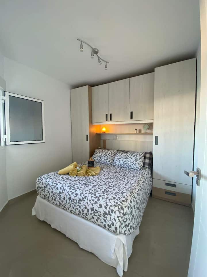 Bedroom with double bed and storage area. Hangers, linens, towels... USB sockets