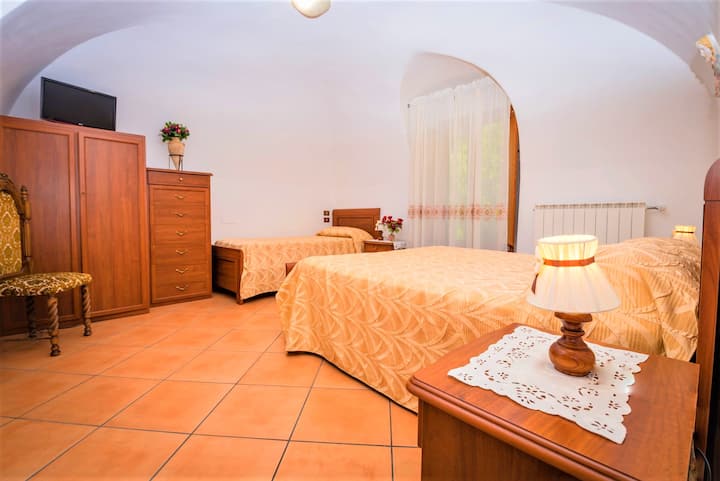 Bedroom with king bed plus a single bed on the top floor, with Sea Views