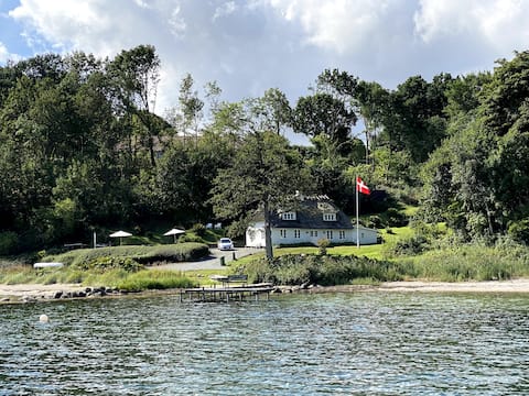 Chestnut house by the water's edge