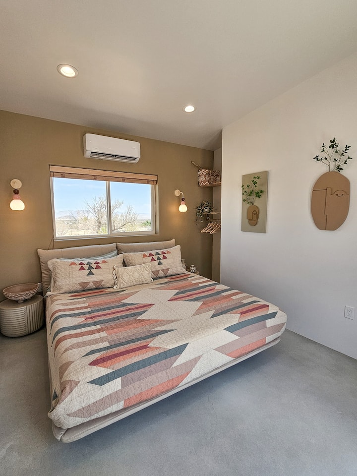Private King bed located in the Guesthouse with endless desert views