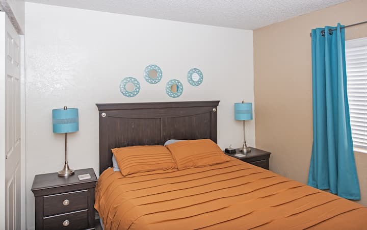 Both bedrooms feature a comfortable queen-sized bed, nightstands, dresser, closet, and blackout curtains for a great night's rest.