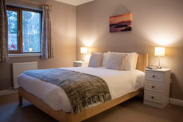 Master bedroom with king sized bed and ensuite shower room