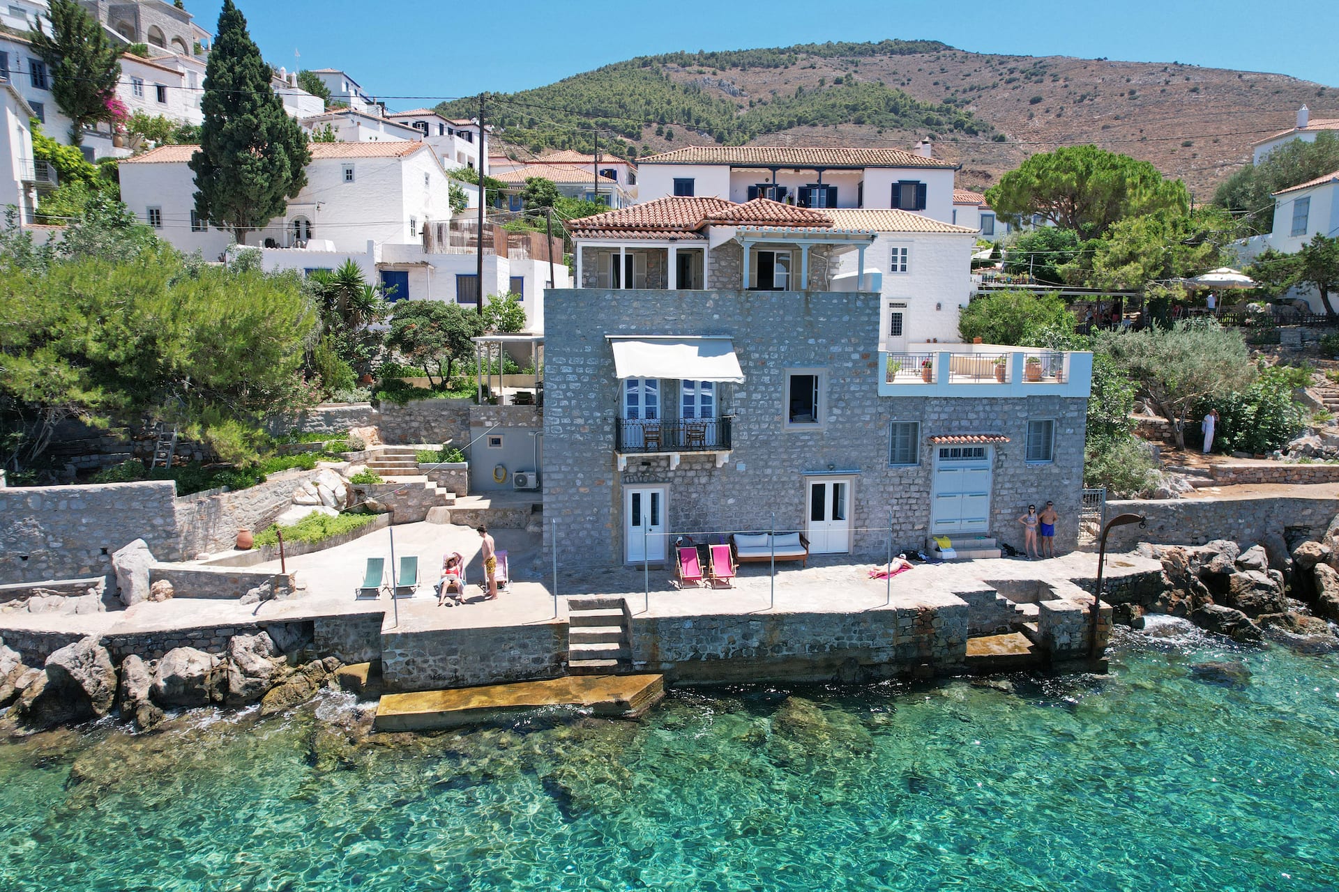 Summer house in Hydra in front of the sea