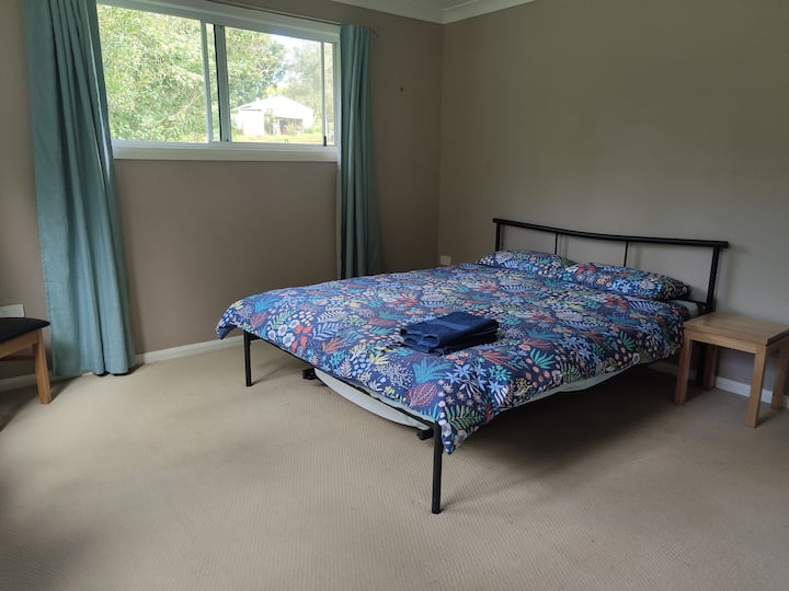 A queen bed in the bedroom, plus the option of a single trundle (roll-out) bed and a portacot for the kids!