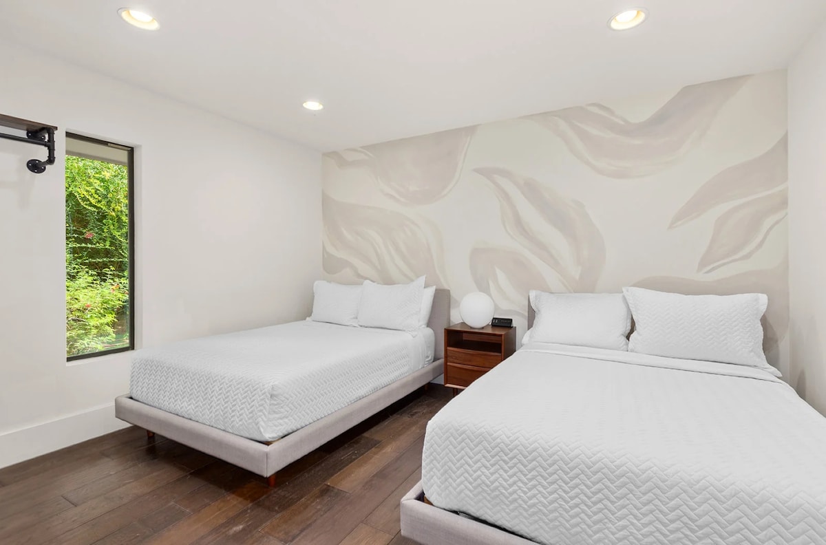 2 Full beds in chic, serene, and sun-soaked room blends modern elegance with cozy comfort—perfect for unwinding after a day in the desert.