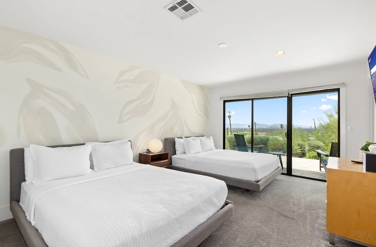 Inviting comfort awaits in the guest room, featuring two queen beds perfect for a peaceful night's sleep and an ensuite full bath.
