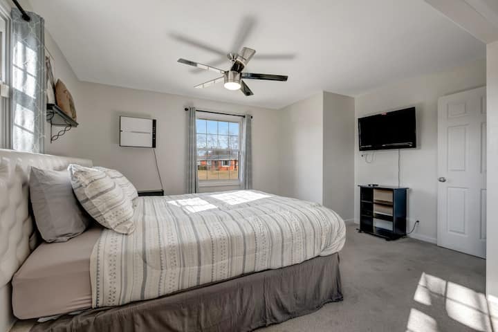 Master Bedroom: Mastering relaxation: Dive into your favorite shows on the TV, embrace total darkness with blackout curtains, and enjoy abundant storage for your essentials.  