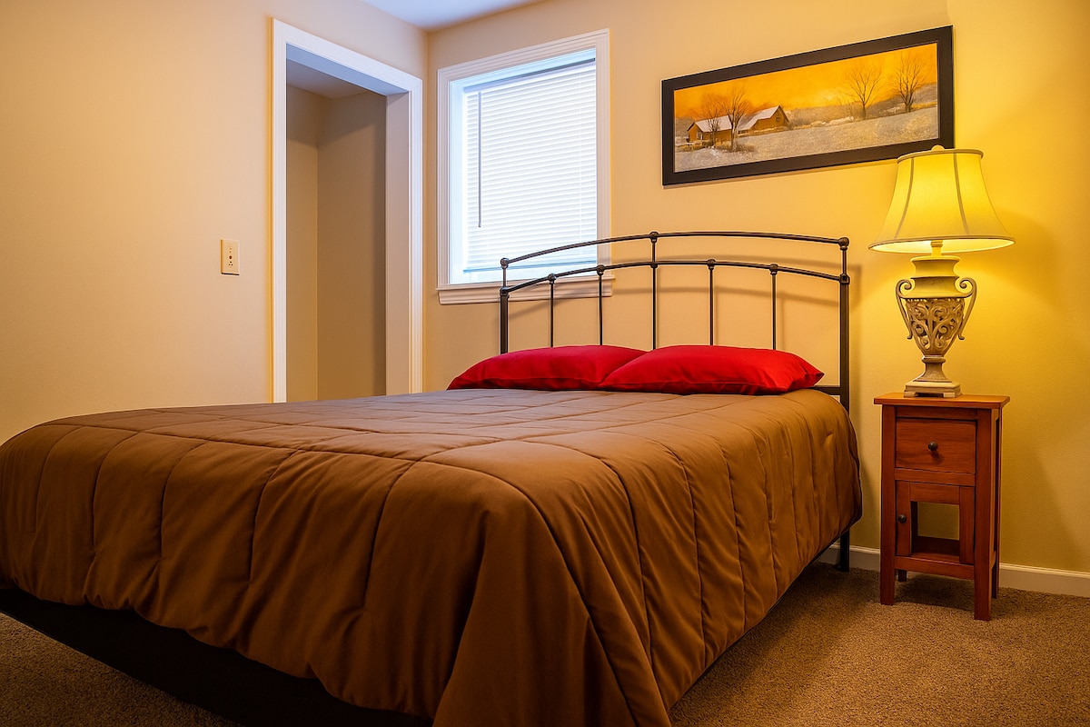 Bedroom Oasis: Bright, inviting space with a comfortable bed and charming decor for relaxation!