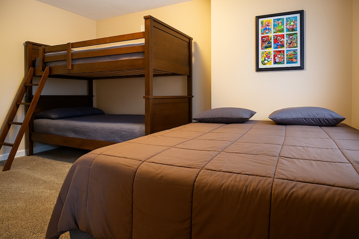 comfortable queen bed and bunk beds in bedroom 3.