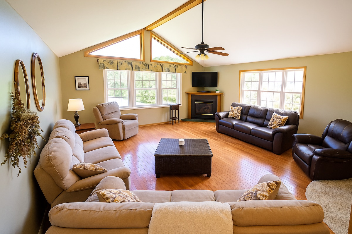 Living Room Retreat: Sunlit space with rich wood accents, perfect for relaxation and fun!