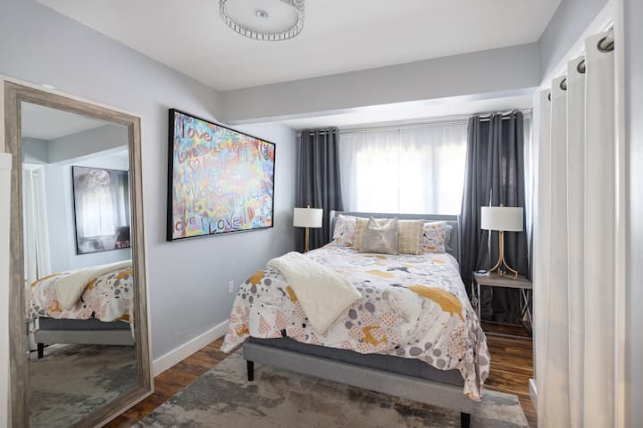 Back out curtains, white noise machine, Extra bedding, 2 suitcase stands, ironing board, humidifier, hangers, iron, full length mirror 