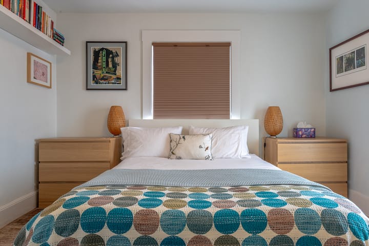 Bedroom with direct access to the deck and the backyard patio.