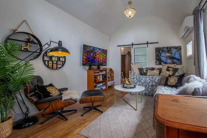 The comfortable living area including Netflix, toys, books and games. There's also a desk and office chair to work from. 