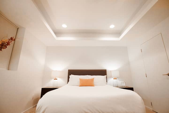 Queen bed with private full bathroom.