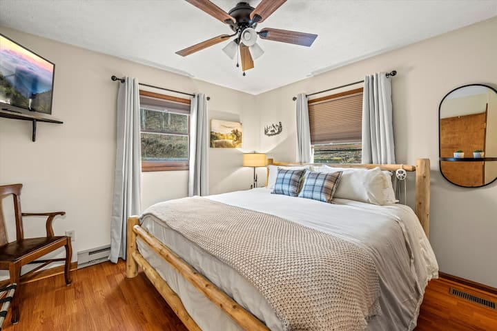 King Size bed with crisp linens. 50" Smart TV for streaming.