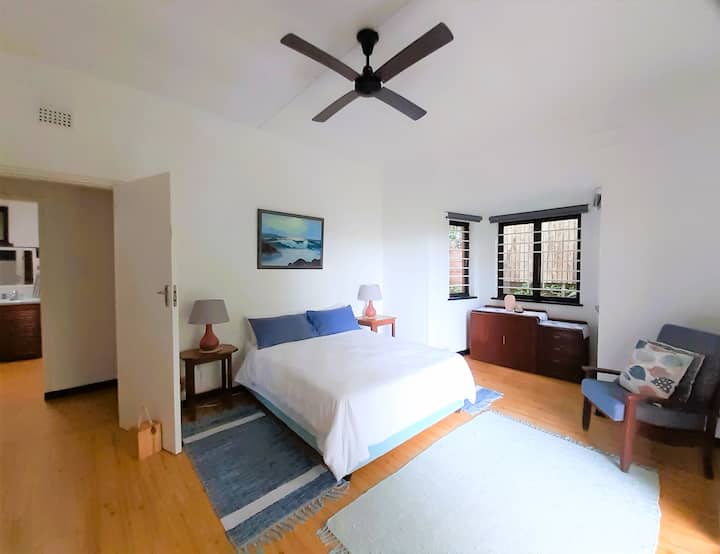 Easy access to a full bathroom is across the passage from the main bedroom.