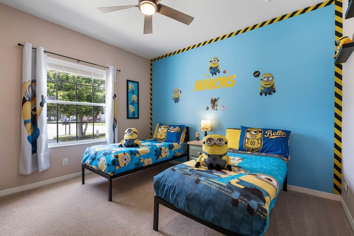 Minions themed bedroom. How many can you count? This fun room will get you laughing with all the silly faces EVERYWHERE!
