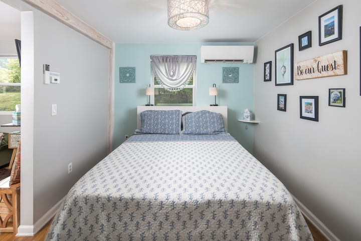 Queen bed on a storage bedframe. Extra pillows and linens in the drawers under the bed along with space to store your belongings.