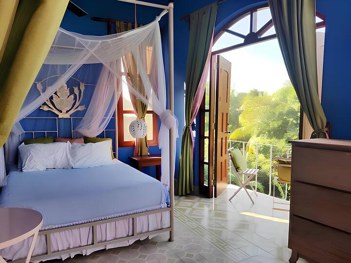 Upstairs bedroom.  Has a balcony and ensuite bathroom.