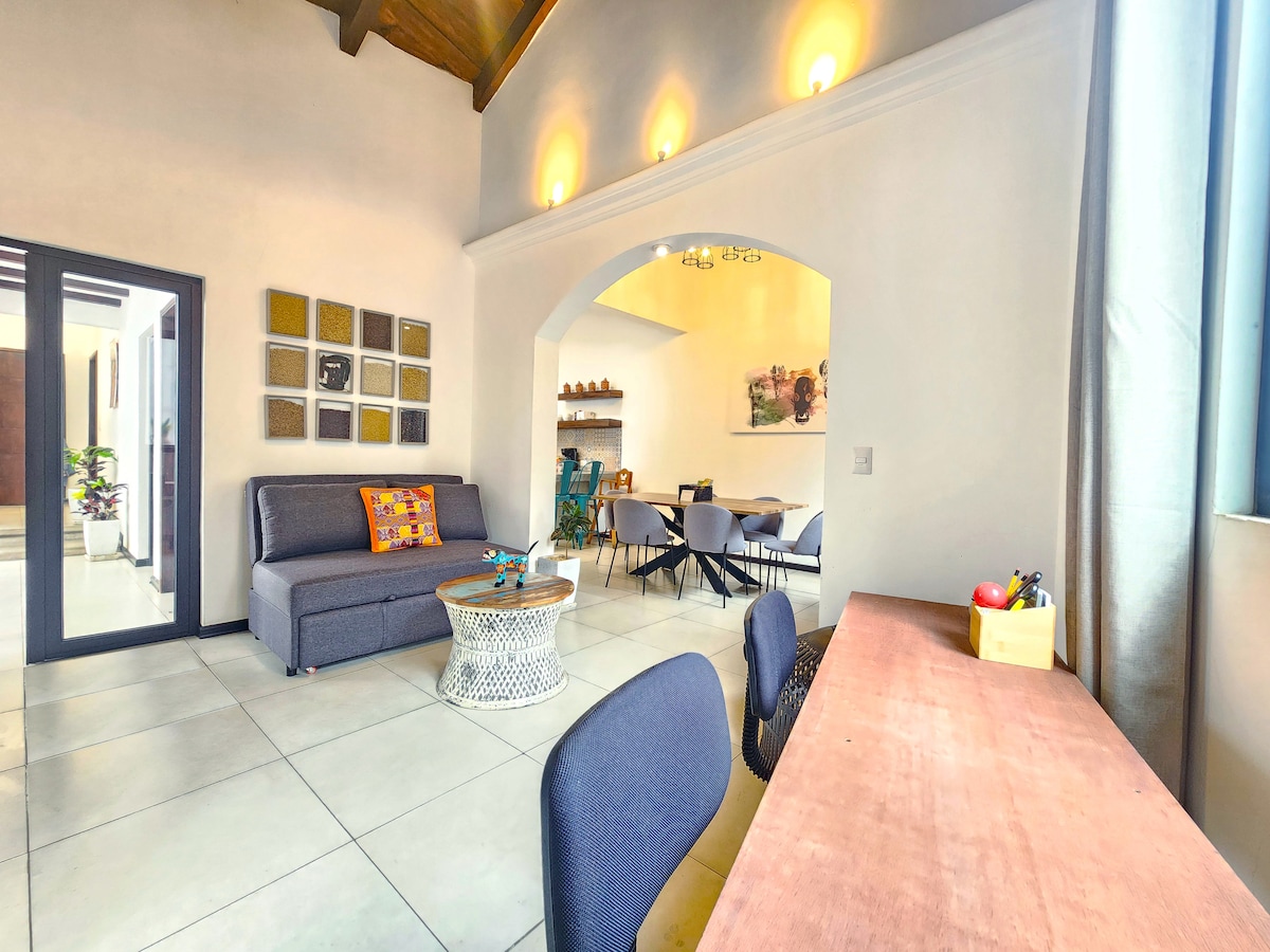 Secondary room with double sofa bed, work desk for 2 people.